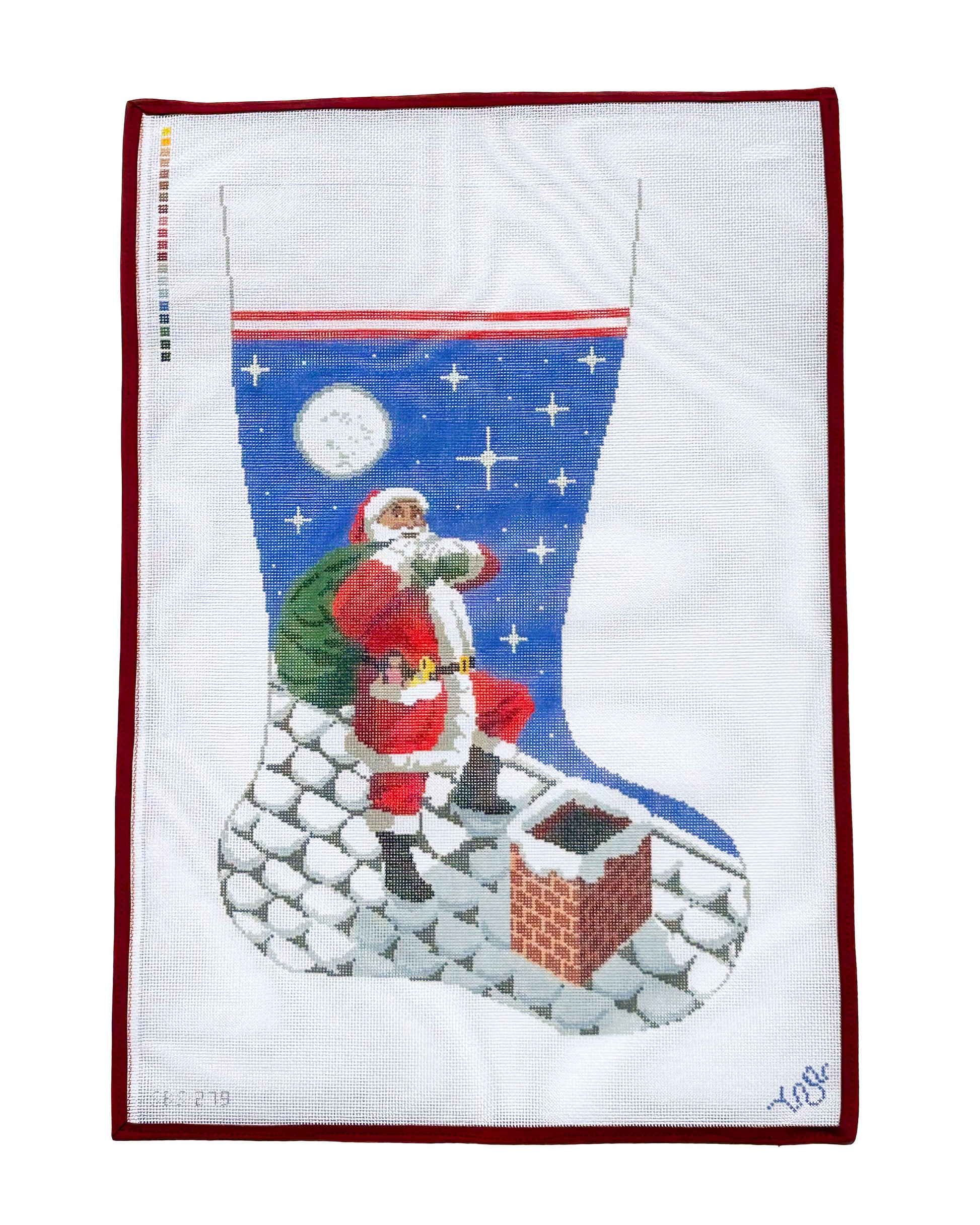 Hand-painted needlepoint Christmas stocking canvas featuring Santa Claus on a snowy rooftop with a full moon and chimney, part of the Heritage Christmas Collection by Spellbound Stitchery.