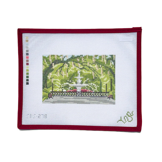 Hand-painted needlepoint canvas of Savannah’s iconic Forsyth Park fountain, shown with lush green trees and classic iron railing in a rectangular design by Spellbound Stitchery.