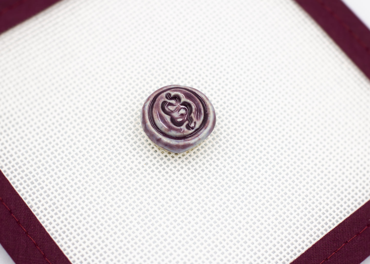 Ceramic Spellbound Logo Needleminder