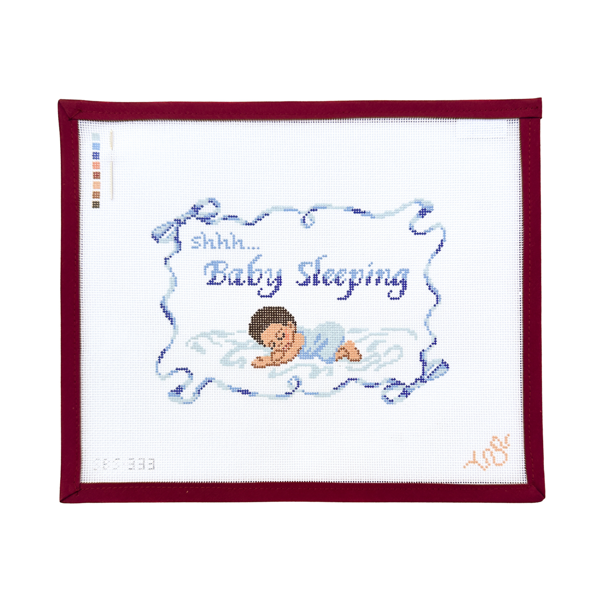 needlepoint canvas with a baby sleeping design