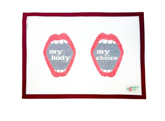 Hand-painted needlepoint canvas featuring two open red mouths, one with the words “my body” and the other with “my choice,” a bold feminist design by Nomad & Needle.