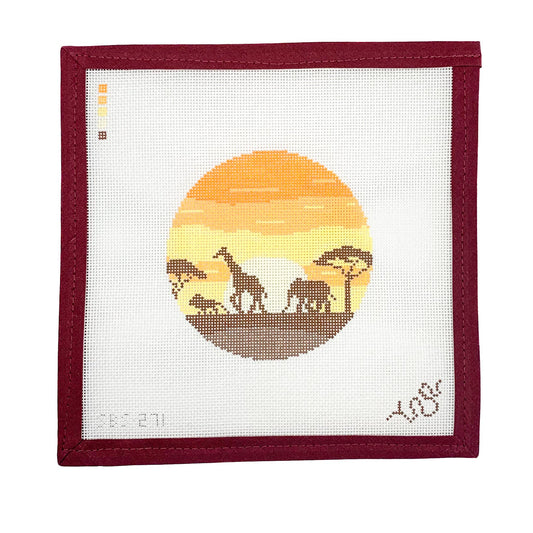 Hand-painted needlepoint canvas featuring a warm-toned sunset with silhouettes of giraffes, elephants, and acacia trees in a circular landscape scene.