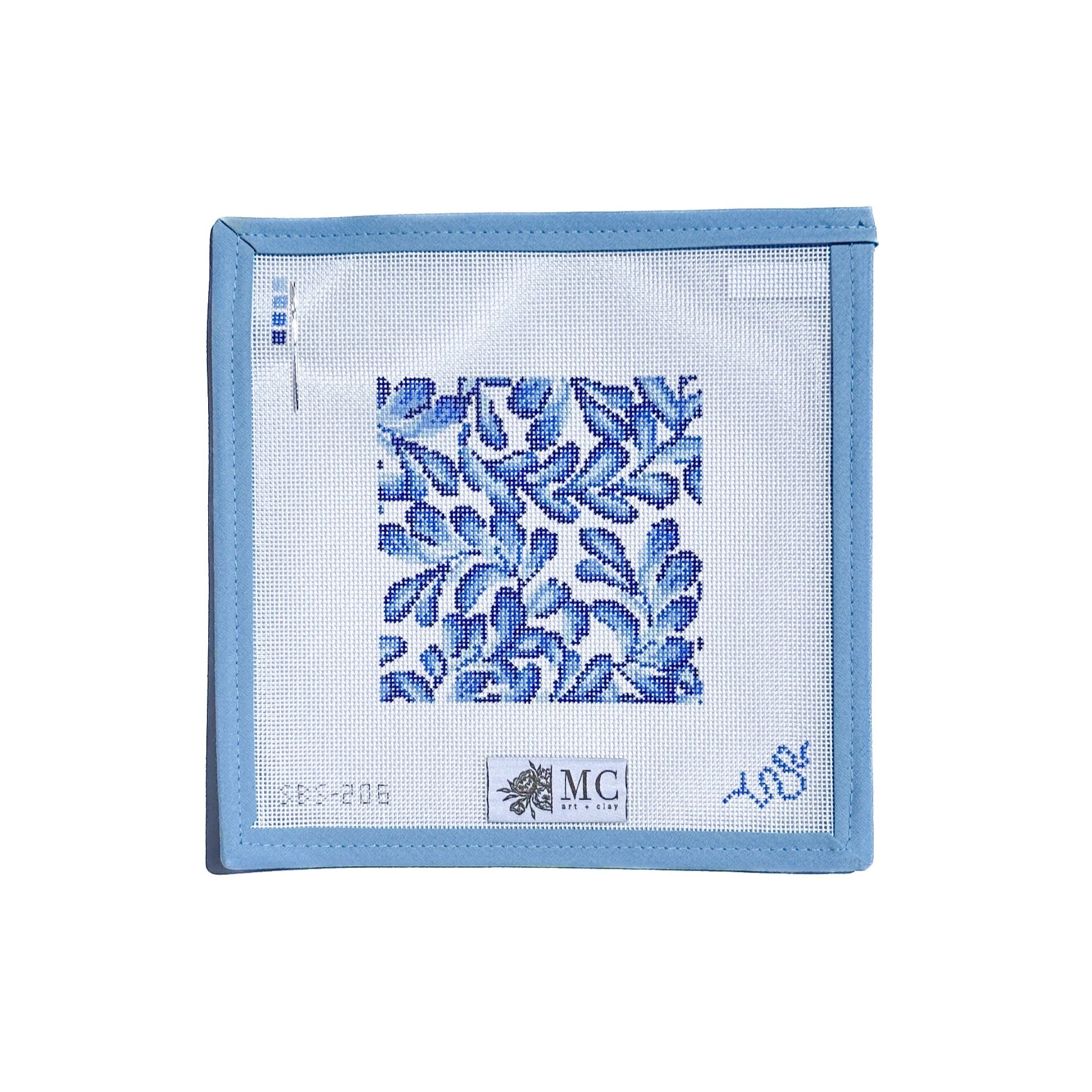 needlepoint canvas square with floral pattern on a white background